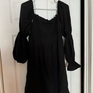 Black cinch dress. Can be off the shoulder or on
